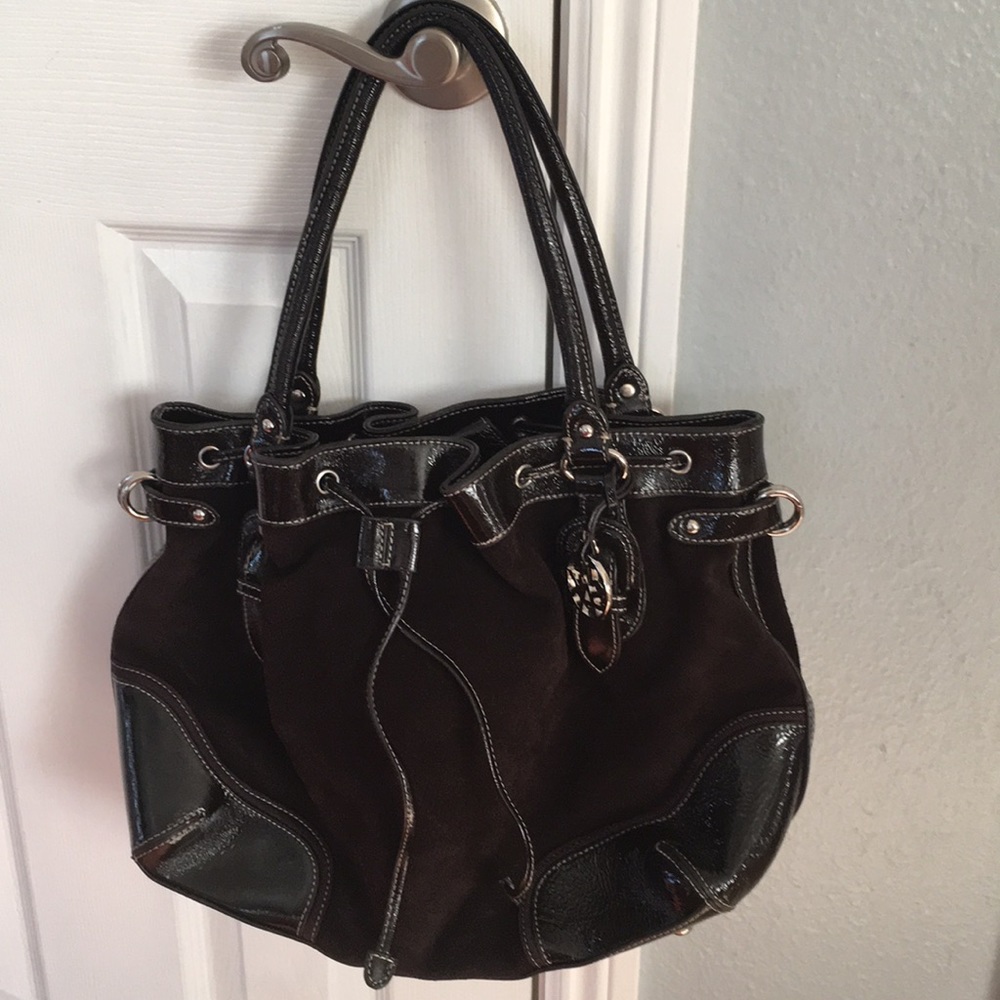 The Sak leather purse, suede and leather with silver tone hardware.